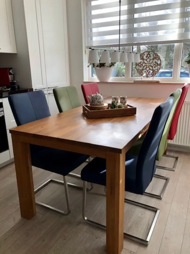 afbeelding van Set van 6 leren eetkamerstoelen met rvs poot