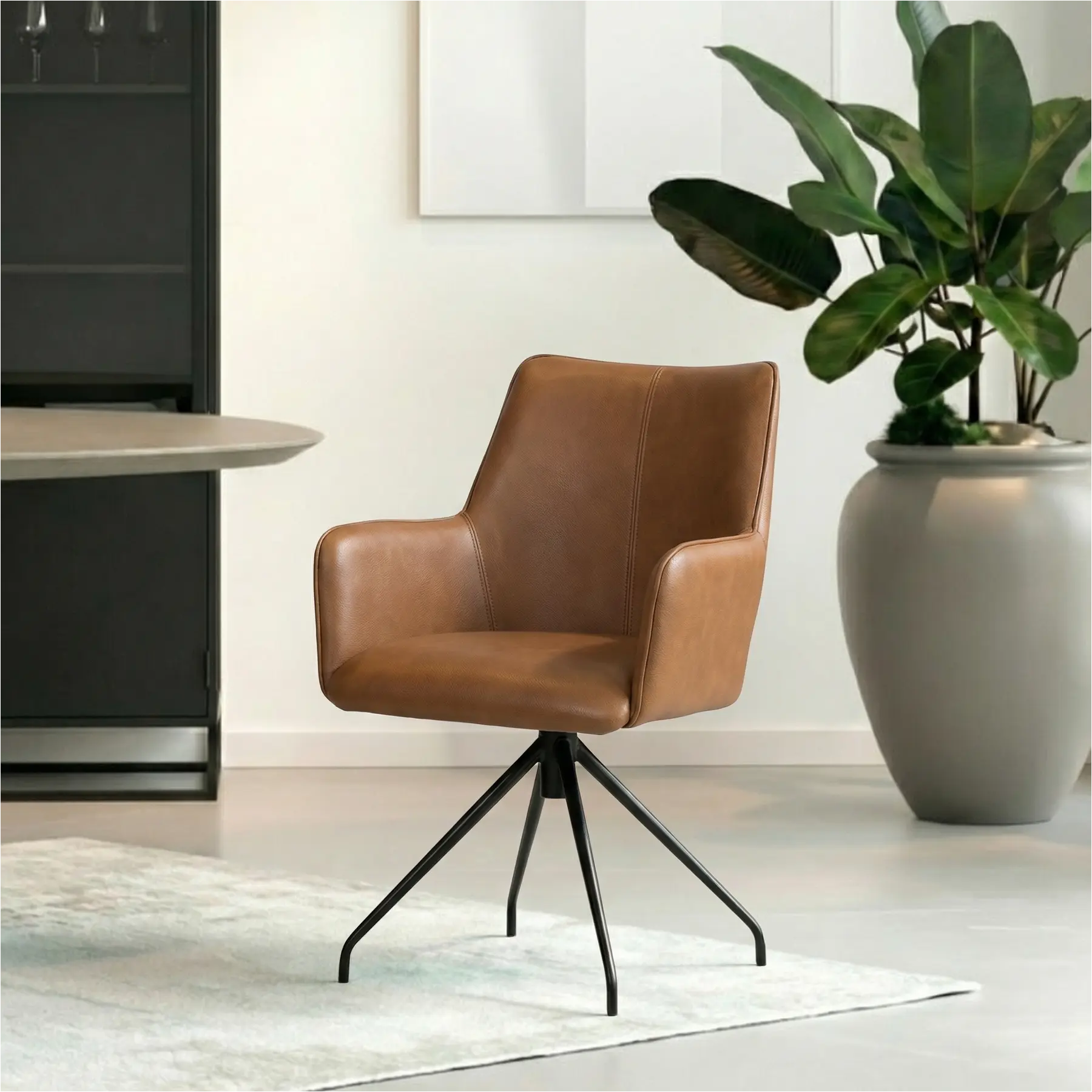 afbeelding van Leren eetkamerstoel Wave - Granada Sahara (cognac) - Spinpoot staal rond zwart