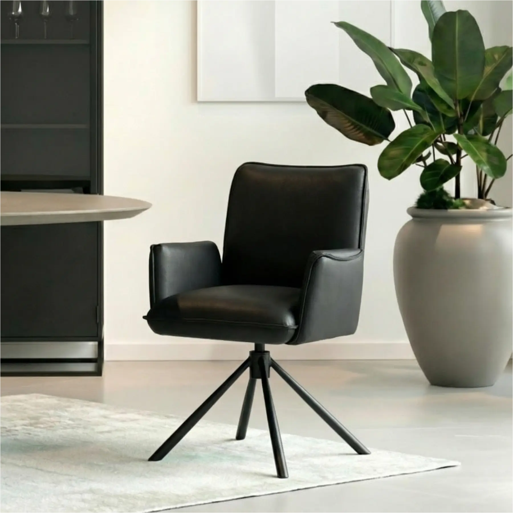 afbeelding van Leren draaibare eetkamerstoel Elite - Toledo Nero (zwart) - Spinpoot staal rond zwart