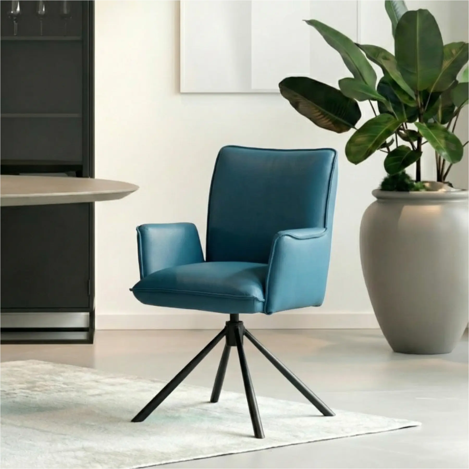 afbeelding van Leren draaibare eetkamerstoel Elite - Toledo Turquoise (blauw) - Spinpoot staal rond zwart