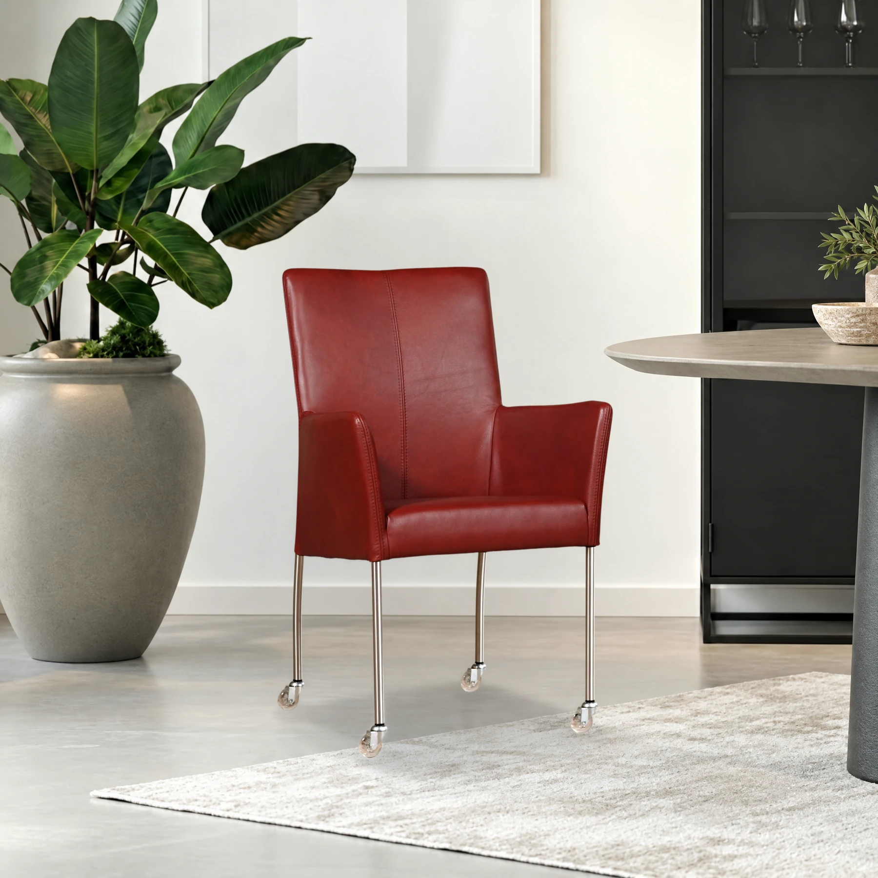 afbeelding van Leren eetkamerstoel Comfort met wieltjes en armleuning - Granada Rouge (rood) - Poten staal rond RVS