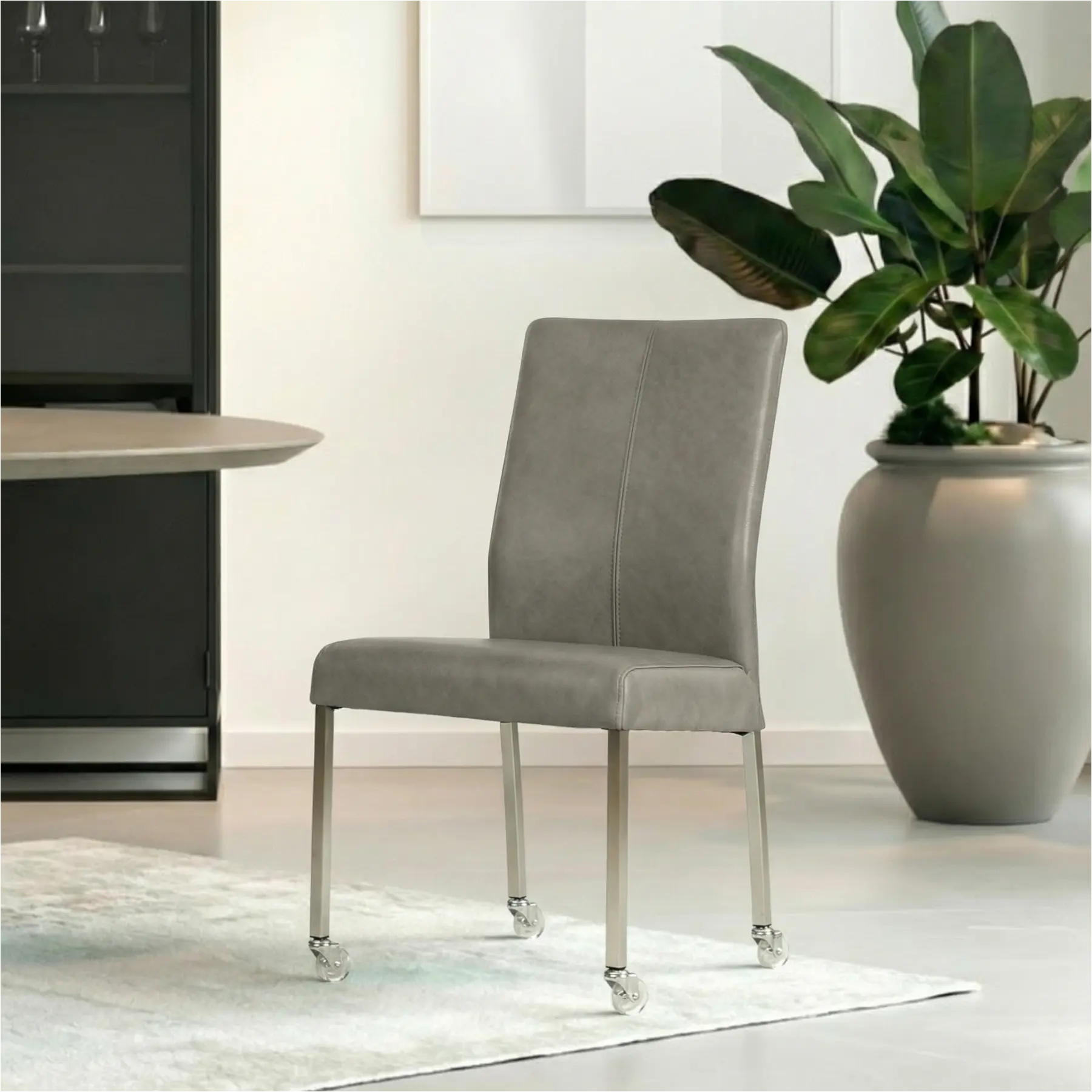 afbeelding van Leren eetkamerstoel Comfort met wieltjes - Granada Steel (grijs) - Poten staal vierkant RVS