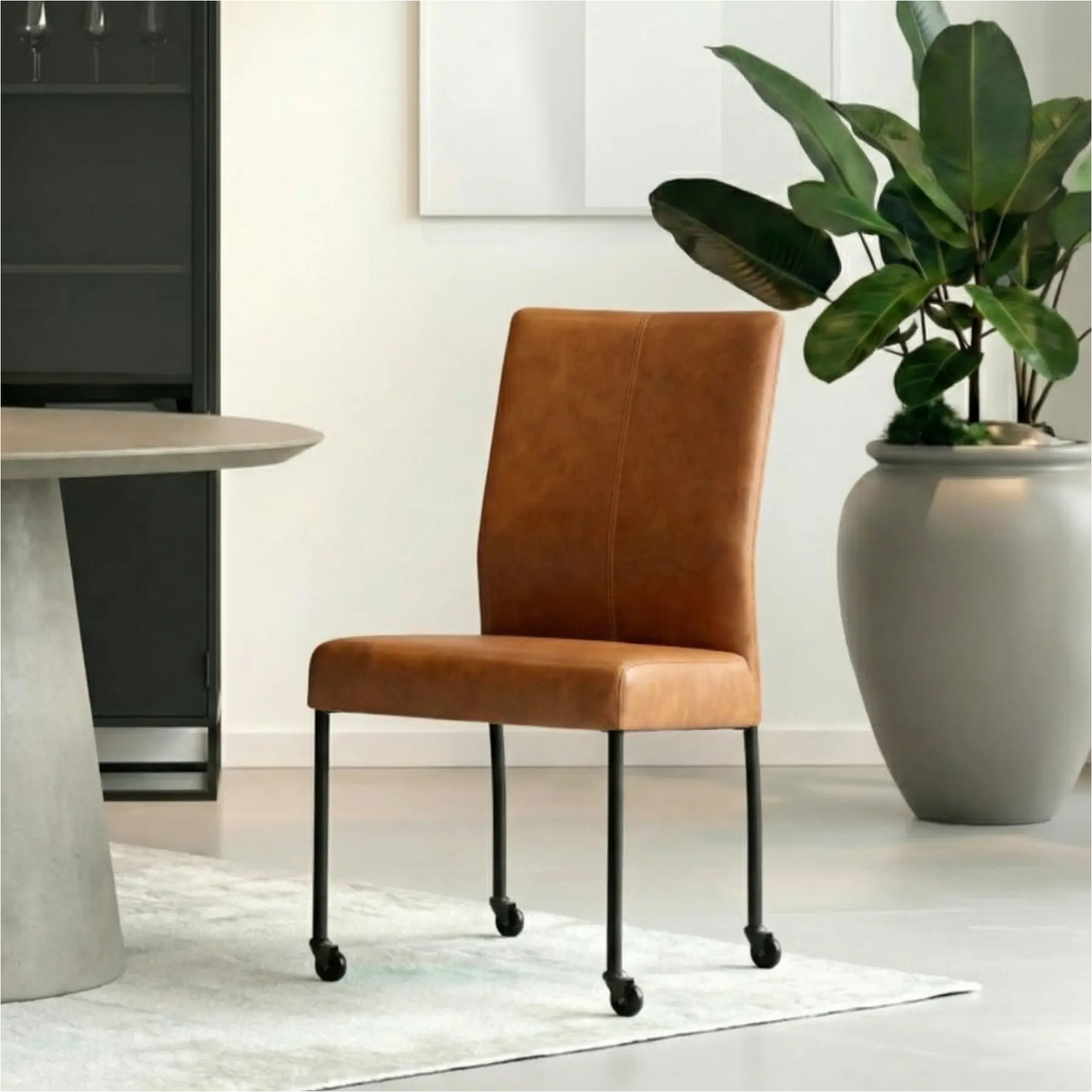 afbeelding van Leren eetkamerstoel Comfort met wieltjes - Rancho Cognac (cognac) - Poten staal rond zwart