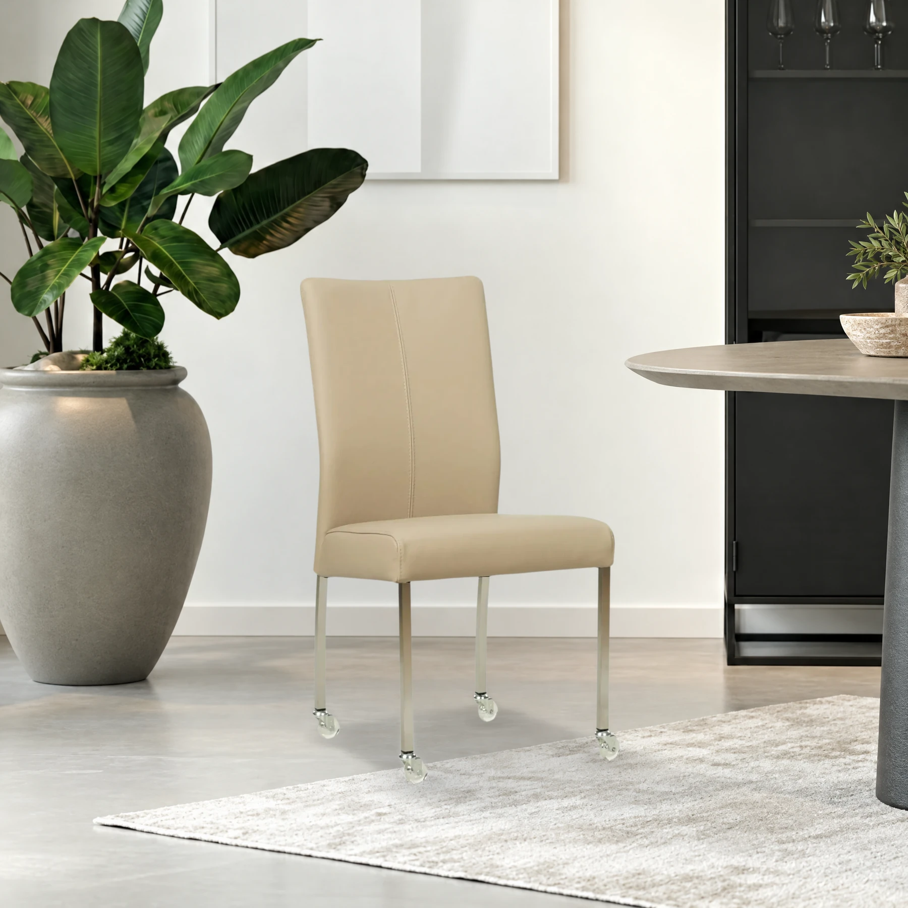 afbeelding van Leren eetkamerstoel Comfort met wieltjes - Toledo Mastic (taupe/bruin) - Poten staal vierkant RVS