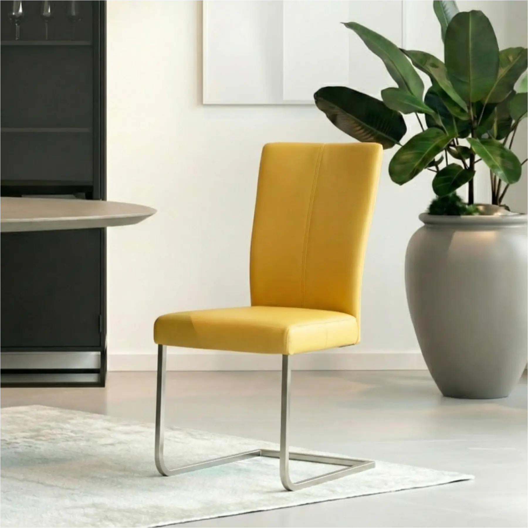 afbeelding van Leren eetkamerstoel Dry - Toledo Giallo (geel) - Sledepoot staal rond RVS