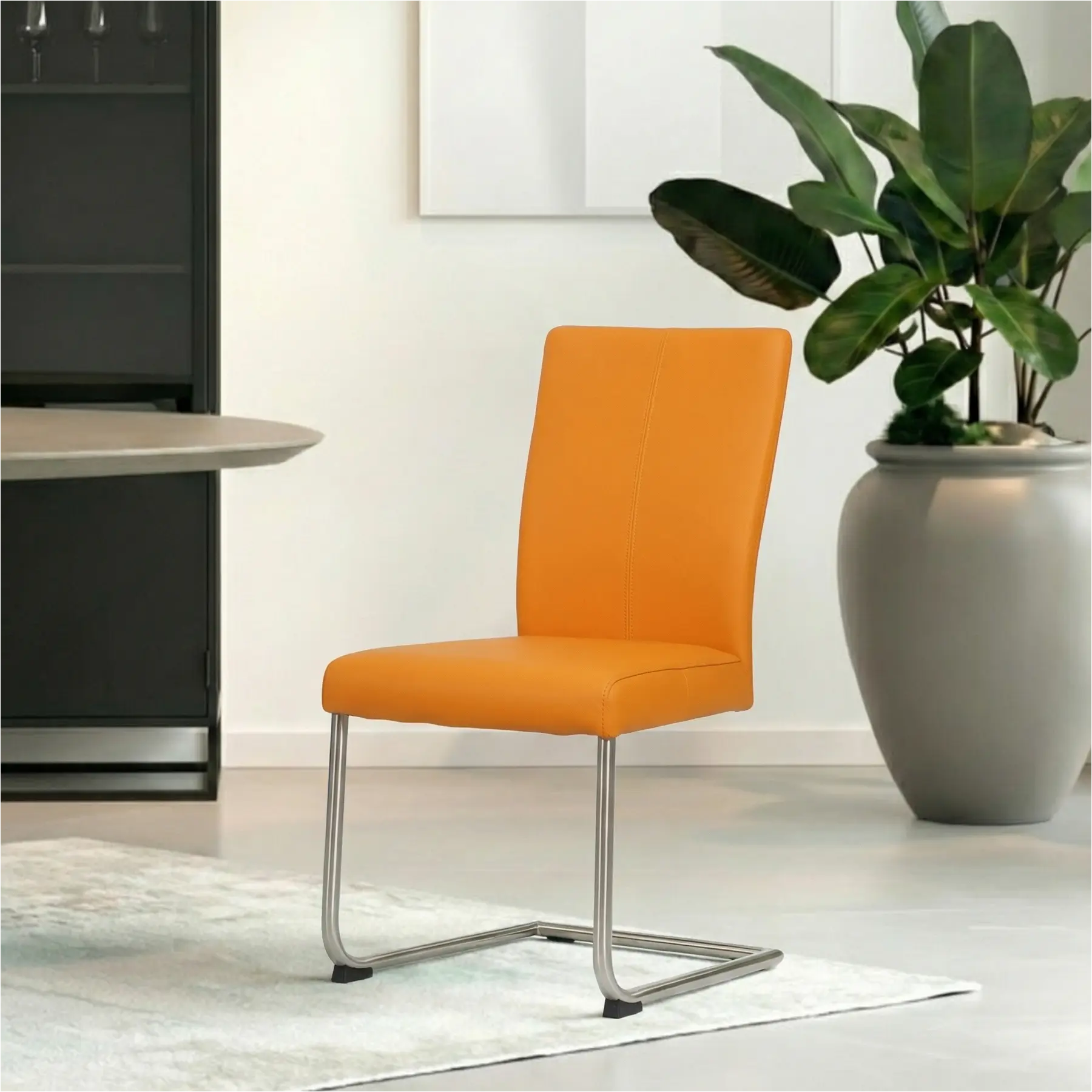 afbeelding van Leren eetkamerstoel Dry - Toledo Mandarin (oranje) - Sledepoot staal rond RVS