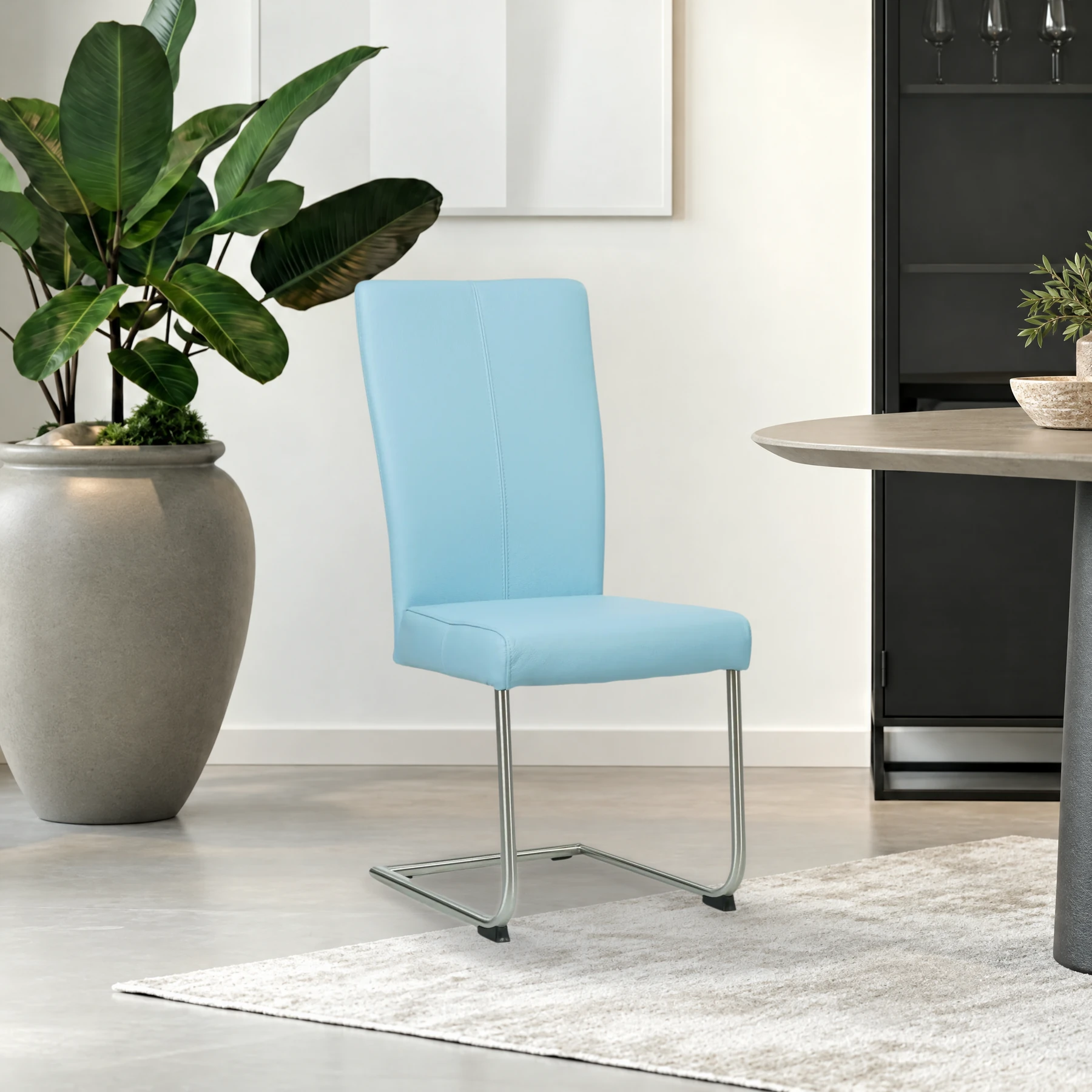 afbeelding van Leren eetkamerstoel Dry - Toledo Sky Blue (lichtblauw) - Sledepoot staal rond RVS