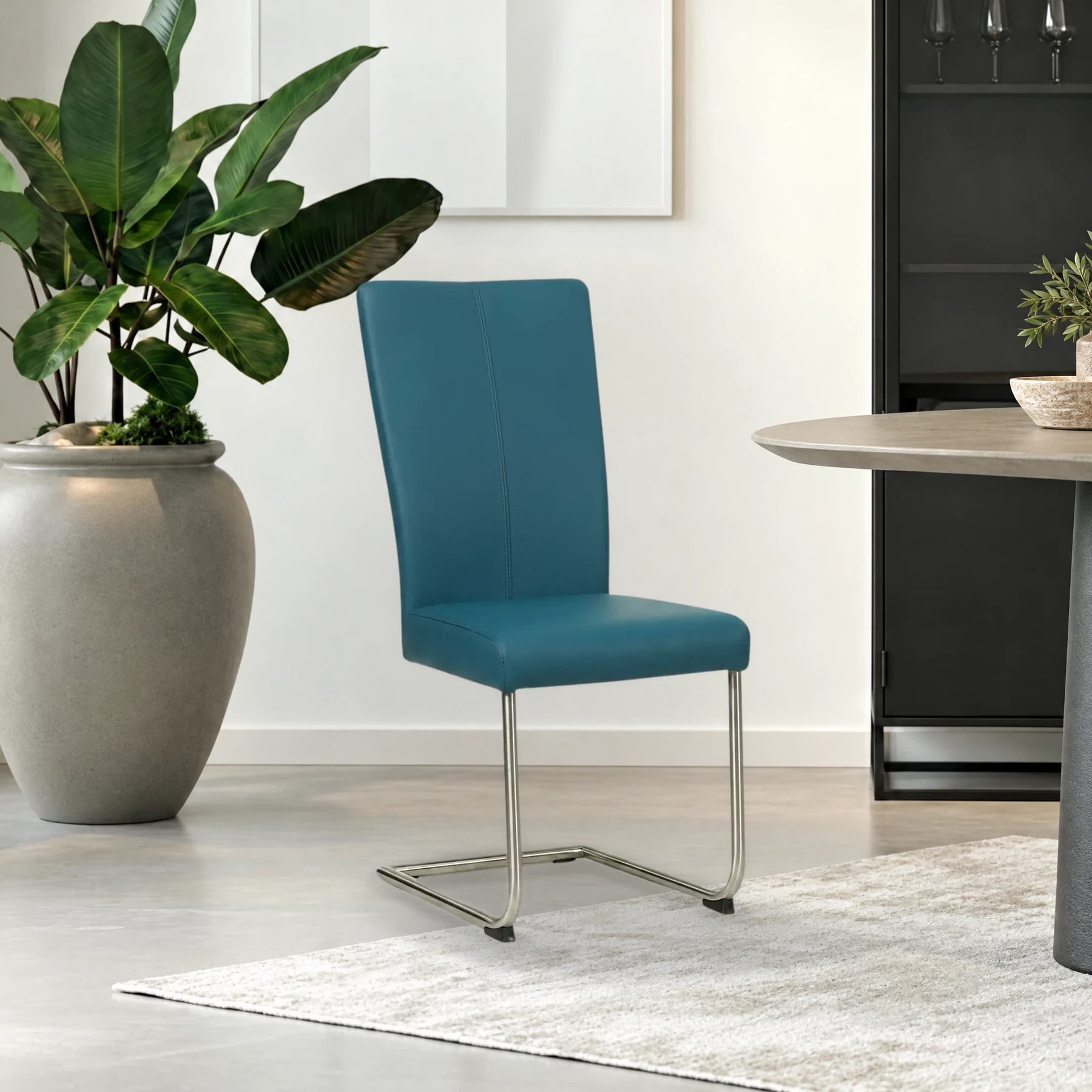 afbeelding van Leren eetkamerstoel Dry - Toledo Turquoise (blauw) - Sledepoot staal rond RVS