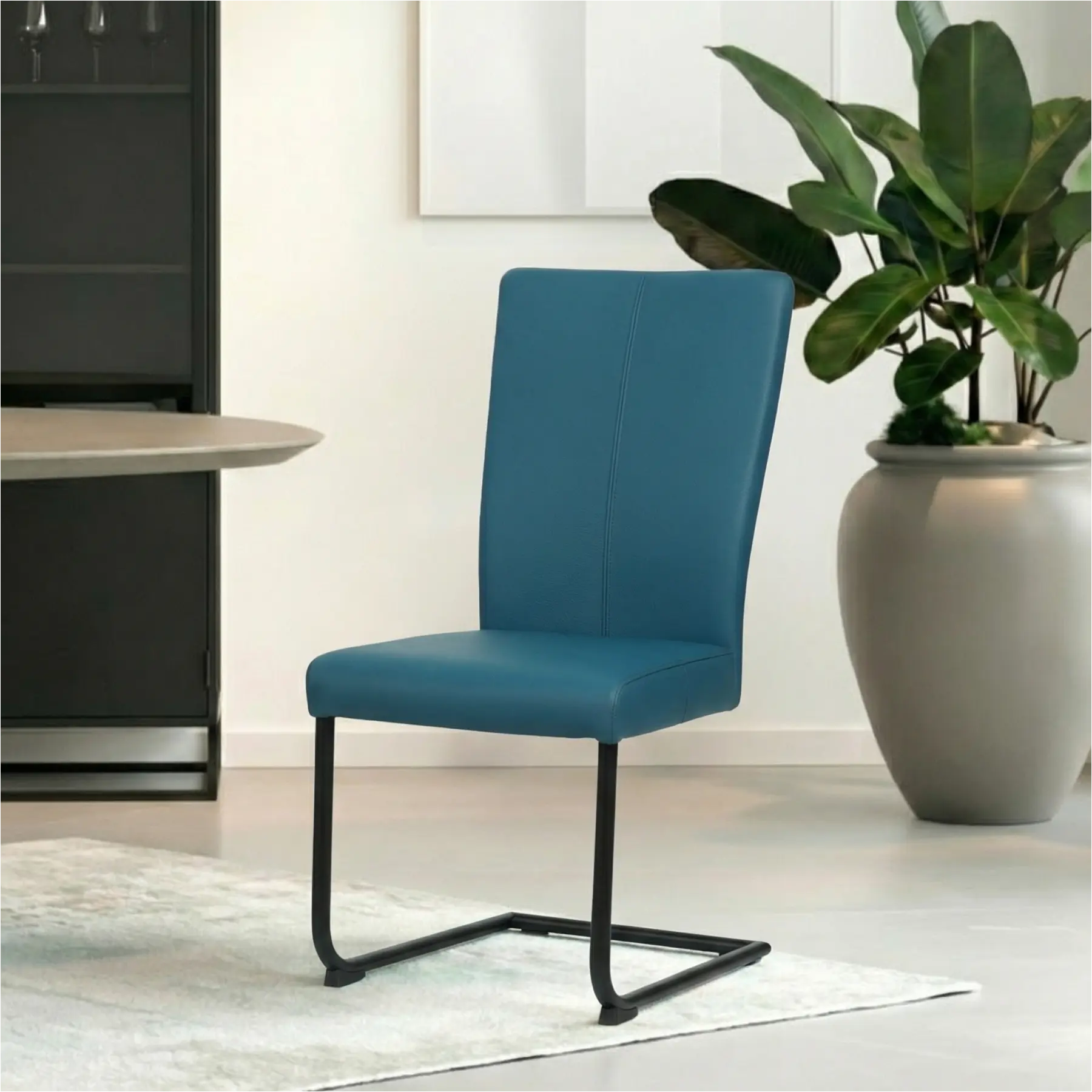 afbeelding van Leren eetkamerstoel Dry - Toledo Turquoise (blauw) - Sledepoot staal rond zwart