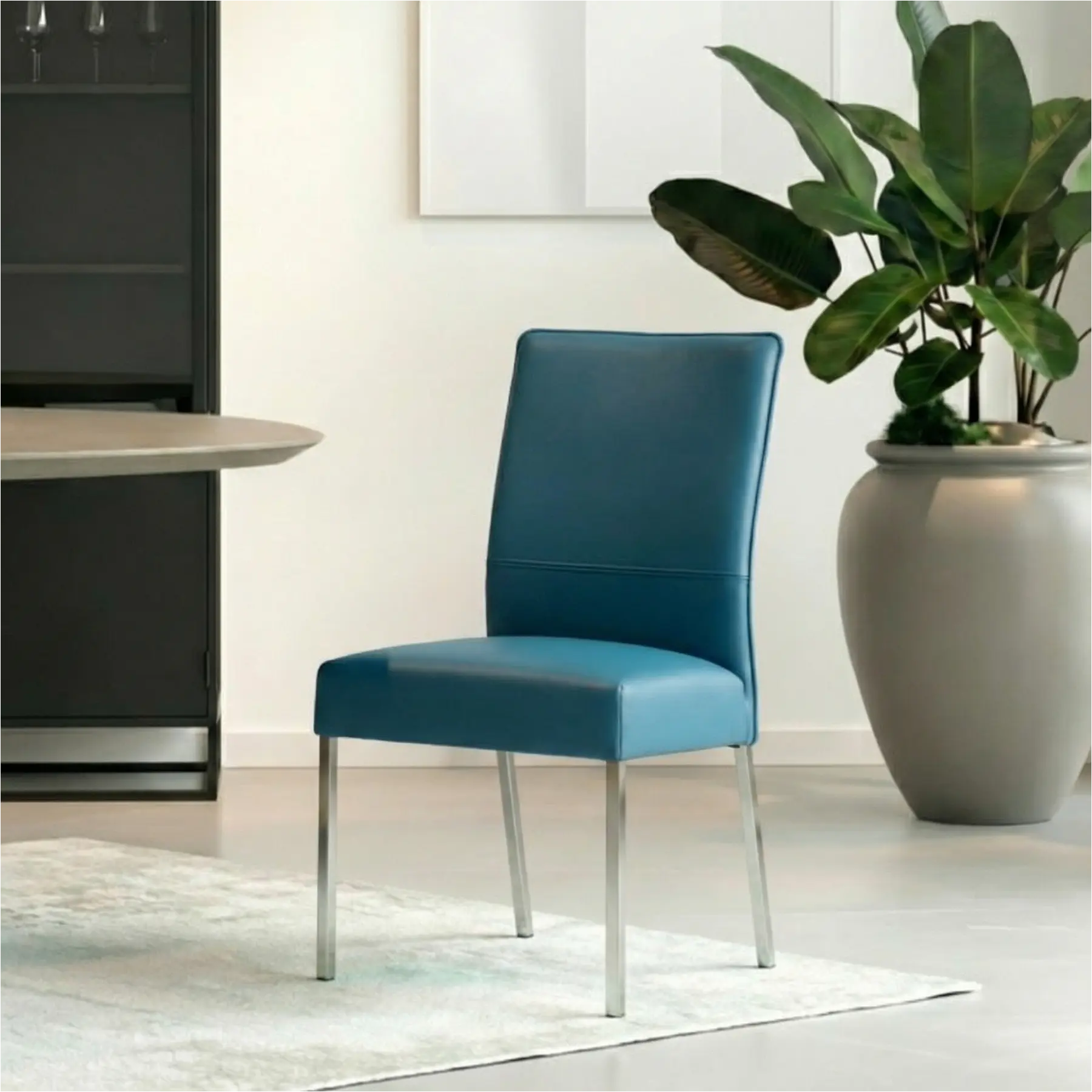 afbeelding van Leren eetkamerstoel Real - Toledo Turquoise (blauw) - Poten staal vierkant RVS