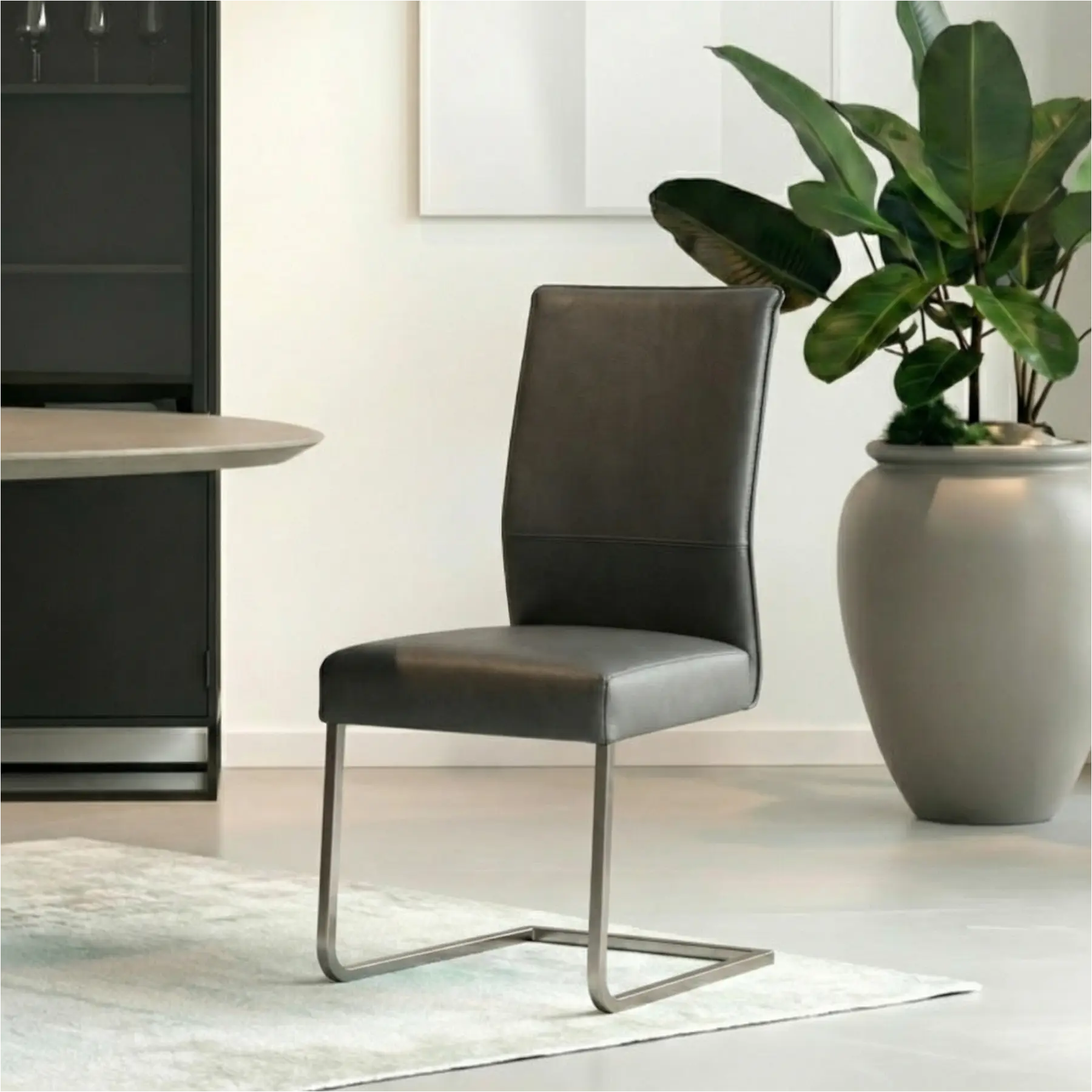 afbeelding van Leren eetkamerstoel Remix - Toledo Antracite (donkergrijs) - Sledepoot staal vierkant RVS