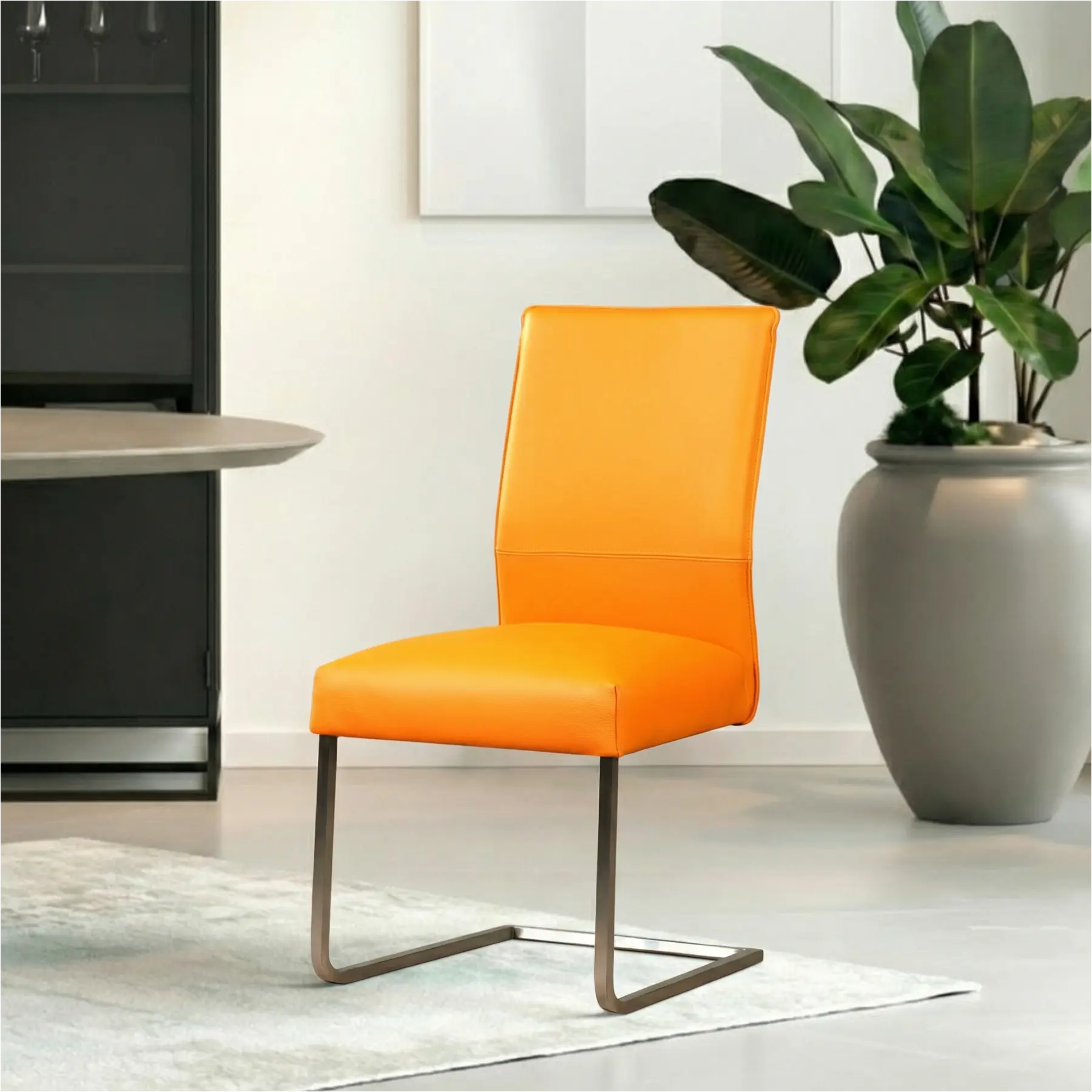 afbeelding van Leren eetkamerstoel Remix - Toledo Mandarin (oranje) - Sledepoot staal vierkant RVS