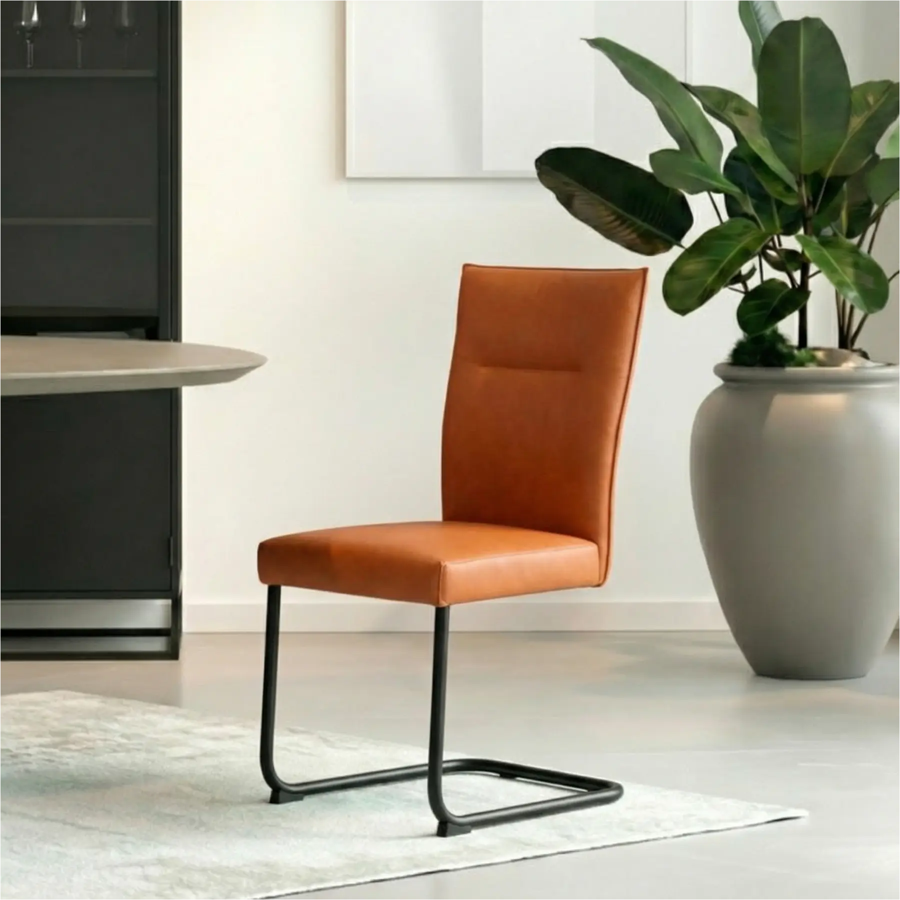 afbeelding van Leren eetkamerstoel Retro - Toledo Cotto (cognac) - Sledepoot staal rond zwart