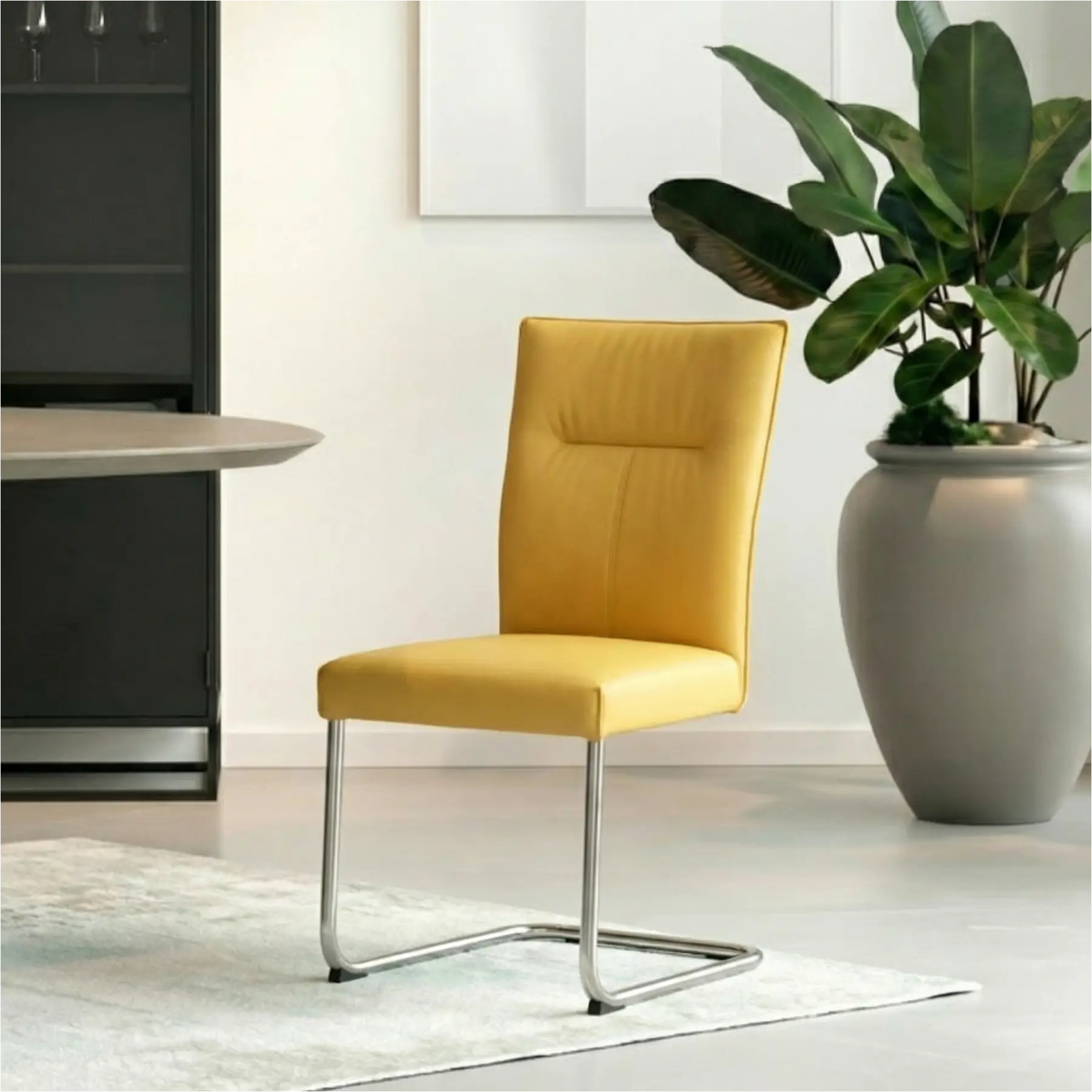 afbeelding van Leren eetkamerstoel Retro - Toledo Giallo (geel) - Sledepoot staal rond RVS