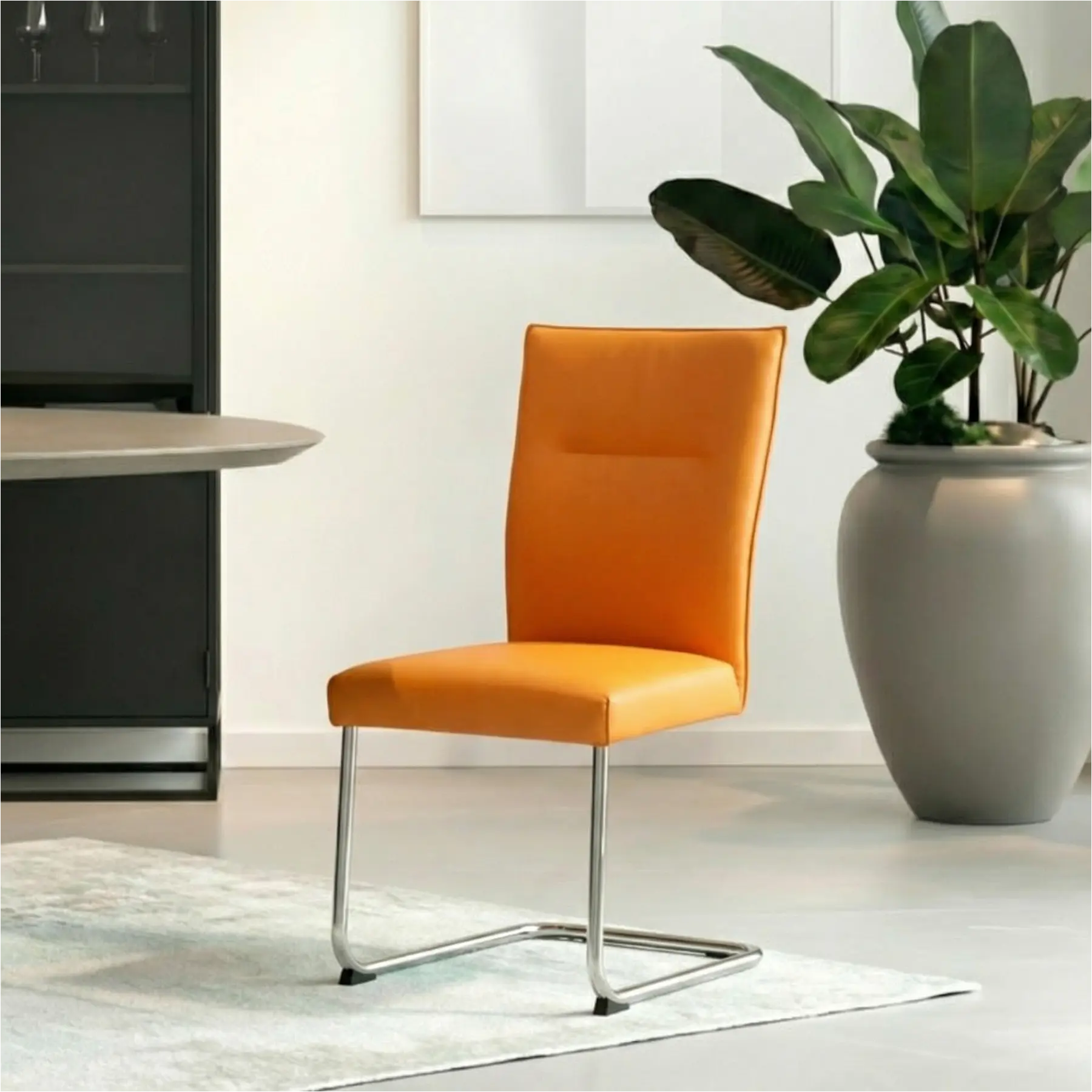 afbeelding van Leren eetkamerstoel Retro - Toledo Mandarin (oranje) - Sledepoot staal rond RVS