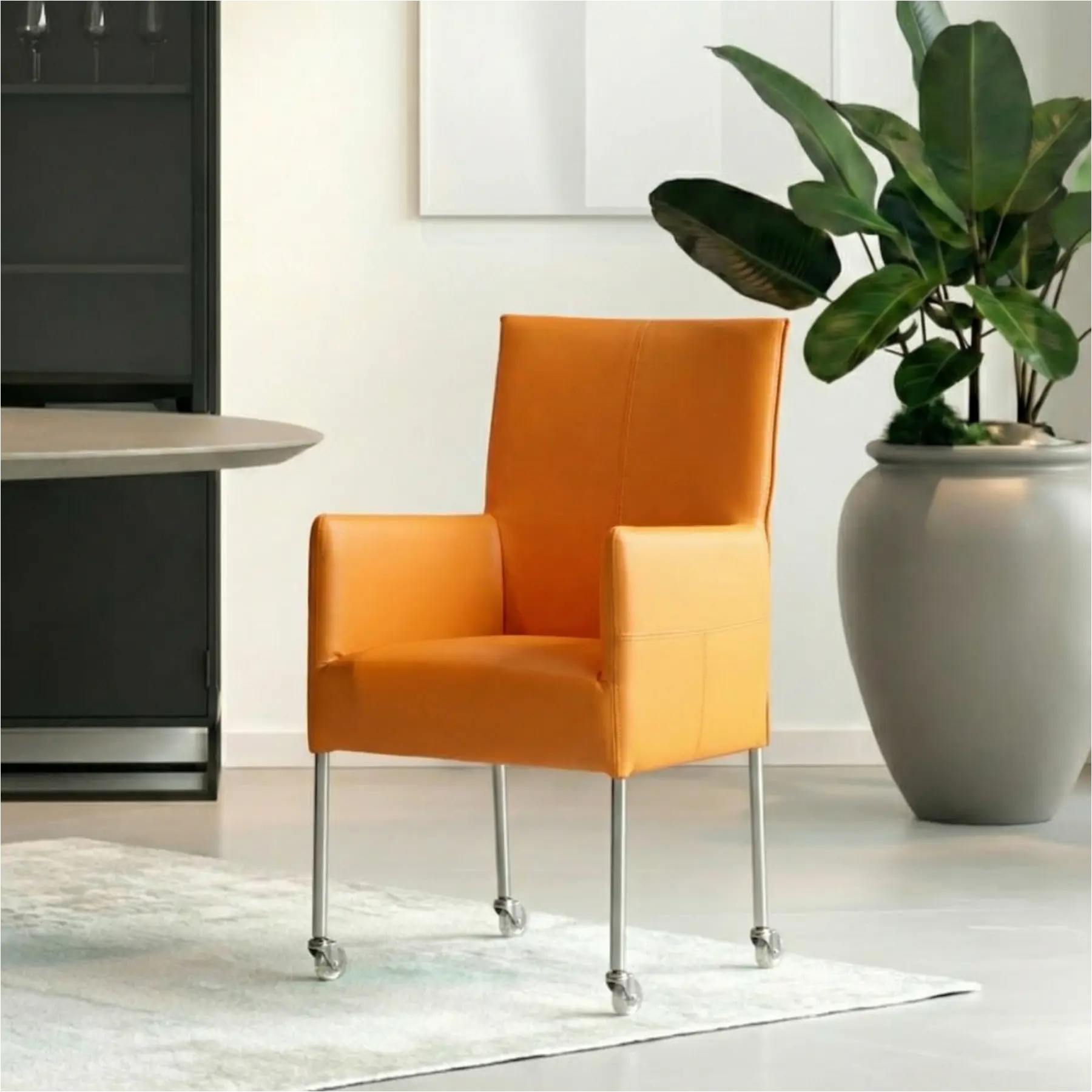 afbeelding van Leren eetkamerstoel Spark - Toledo Mandarin (oranje) - Poten staal rond RVS