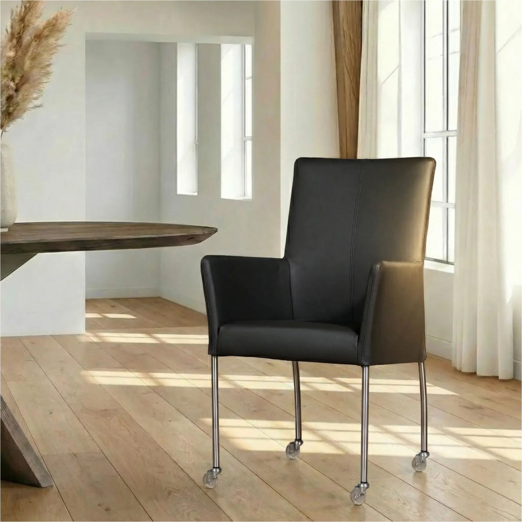 afbeelding van Leren eetkamerstoel Comfort met wieltjes en armleuning - Toledo Antracite (donkergrijs) - Poten staal rond RVS