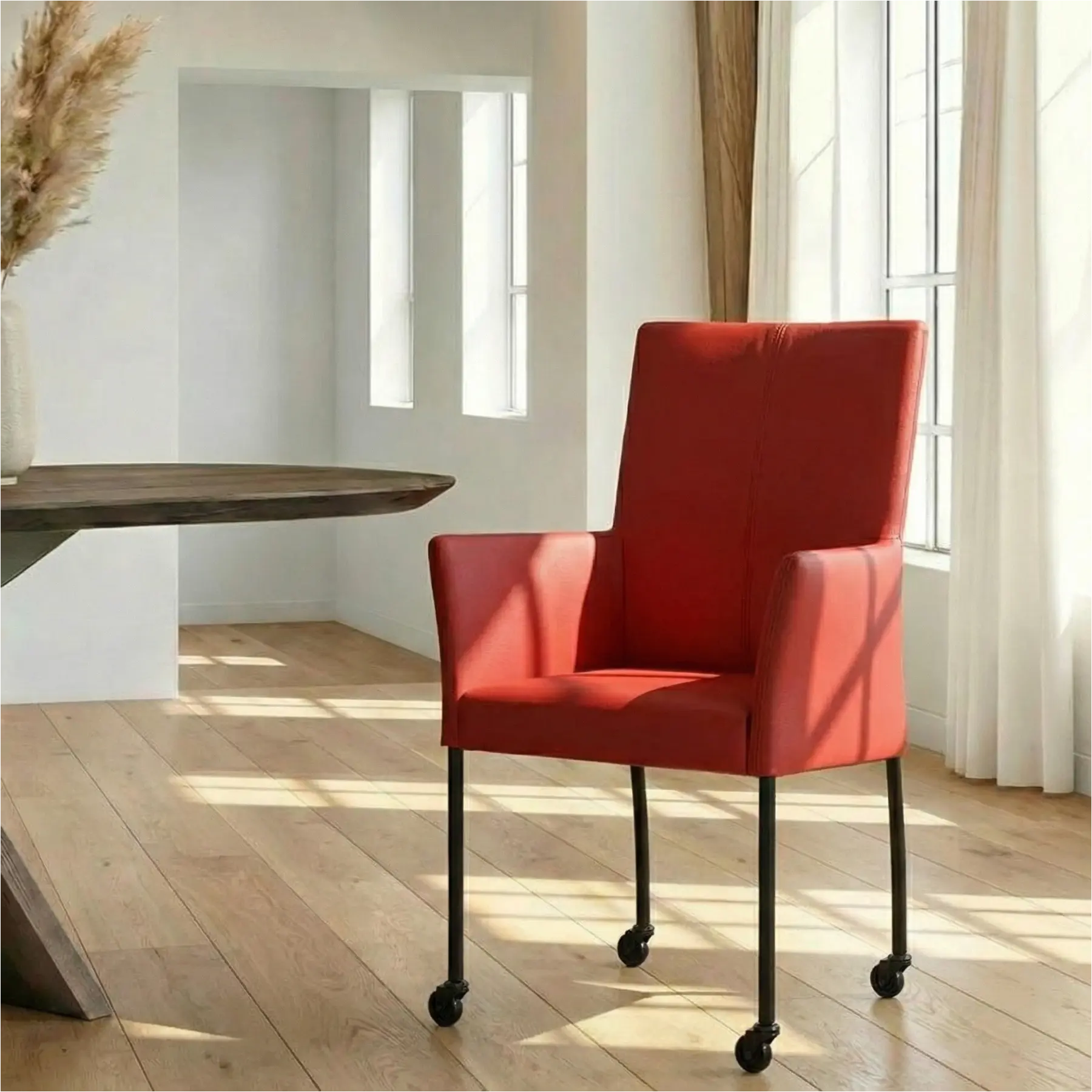 afbeelding van Leren eetkamerstoel Comfort met wieltjes en armleuning - Toledo Ducati (rood) - Poten staal rond zwart