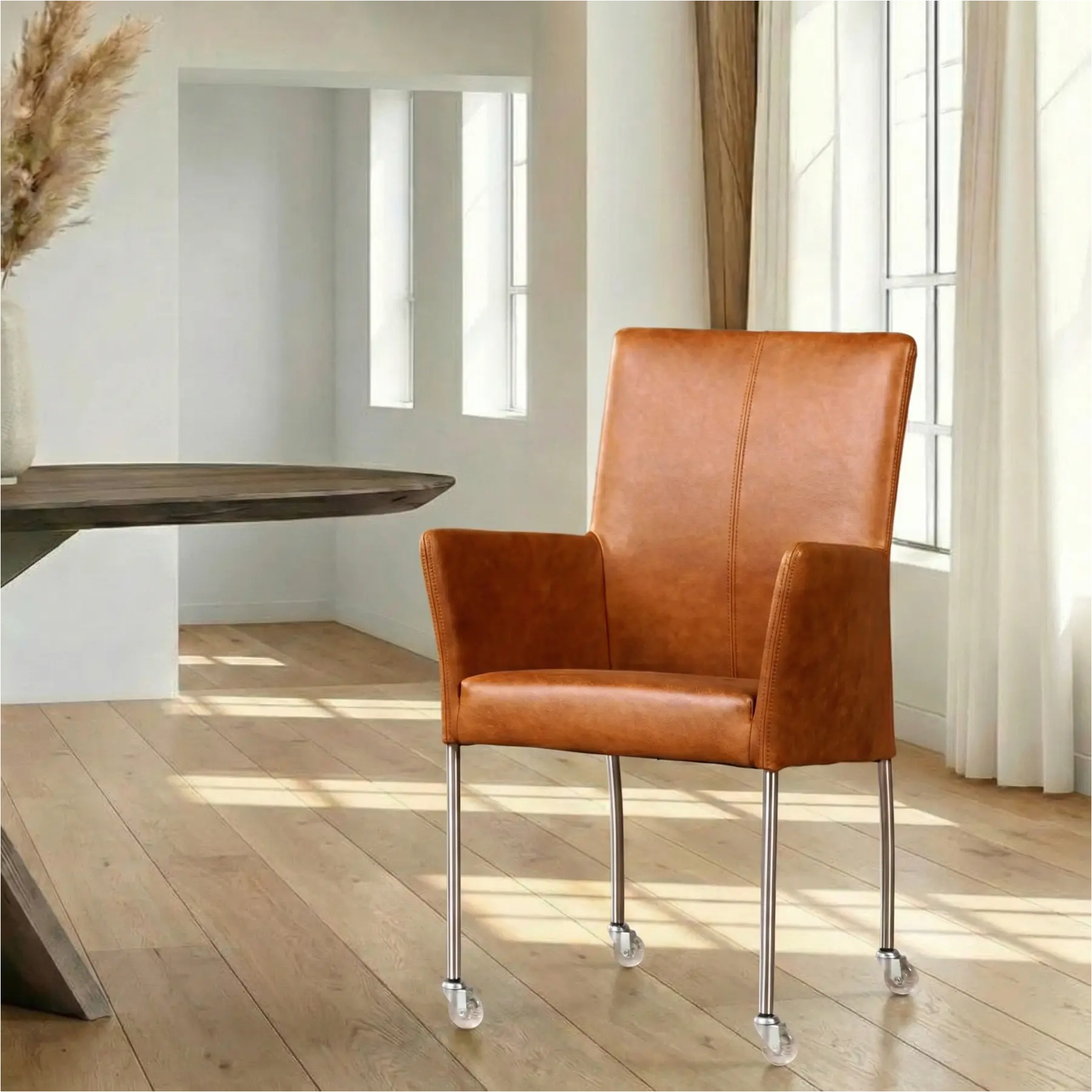 afbeelding van Leren eetkamerstoel Comfort met wieltjes en armleuning - Vintage Cognac (cognac) - Poten staal rond RVS