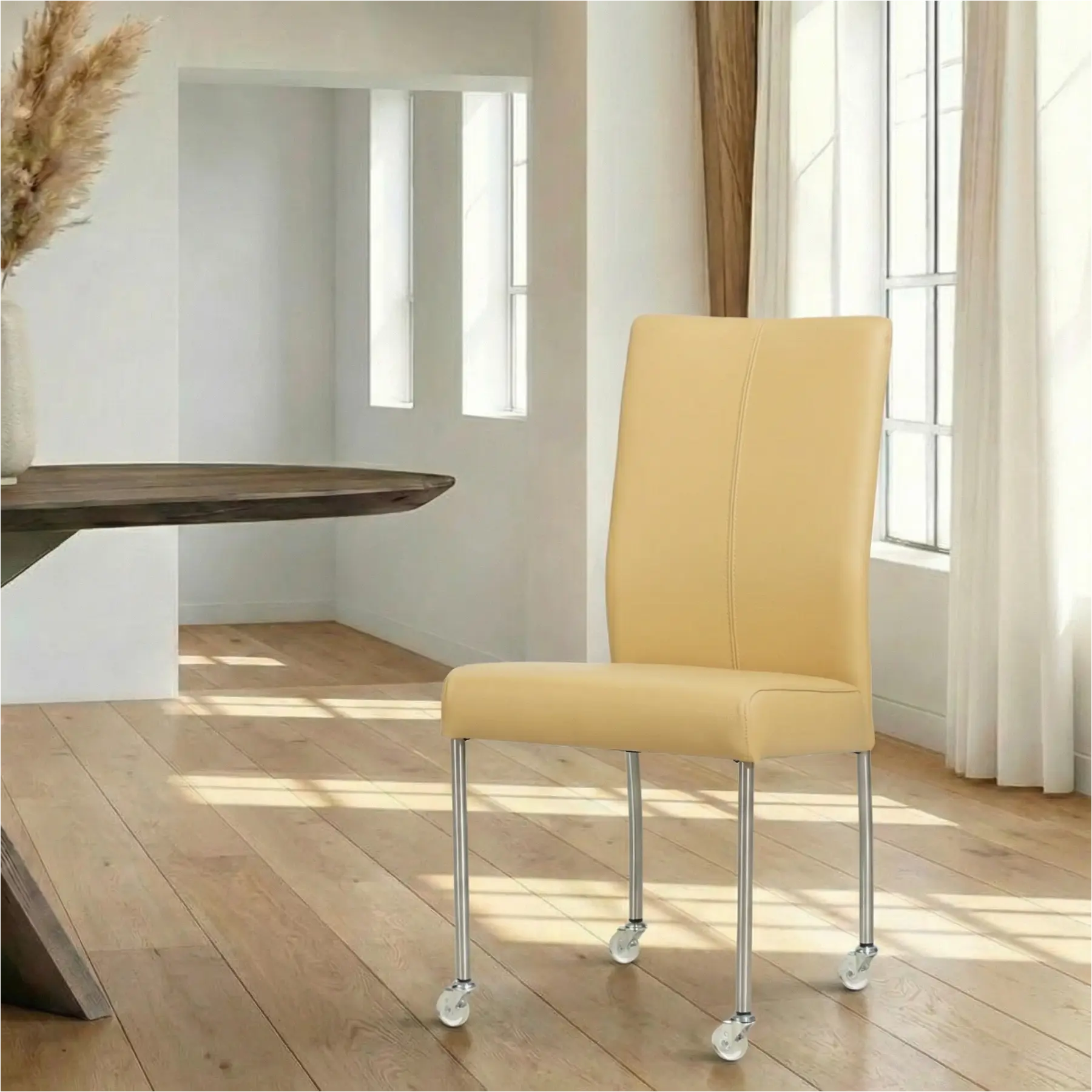 afbeelding van Leren eetkamerstoel Comfort met wieltjes - Toledo Dessert (geel) - Poten staal rond RVS