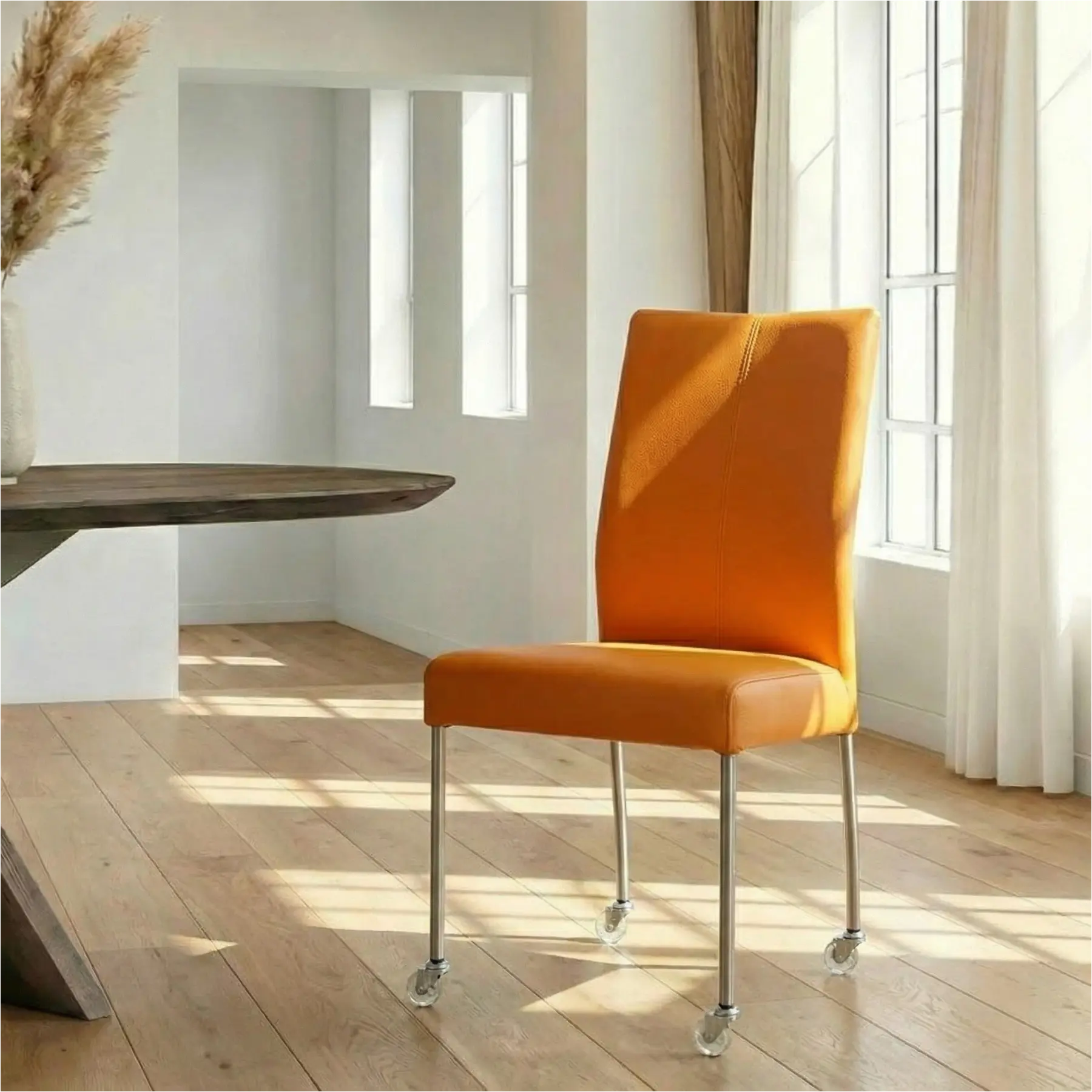 afbeelding van Leren eetkamerstoel Comfort met wieltjes - Toledo Mandarin (oranje) - Poten staal rond RVS