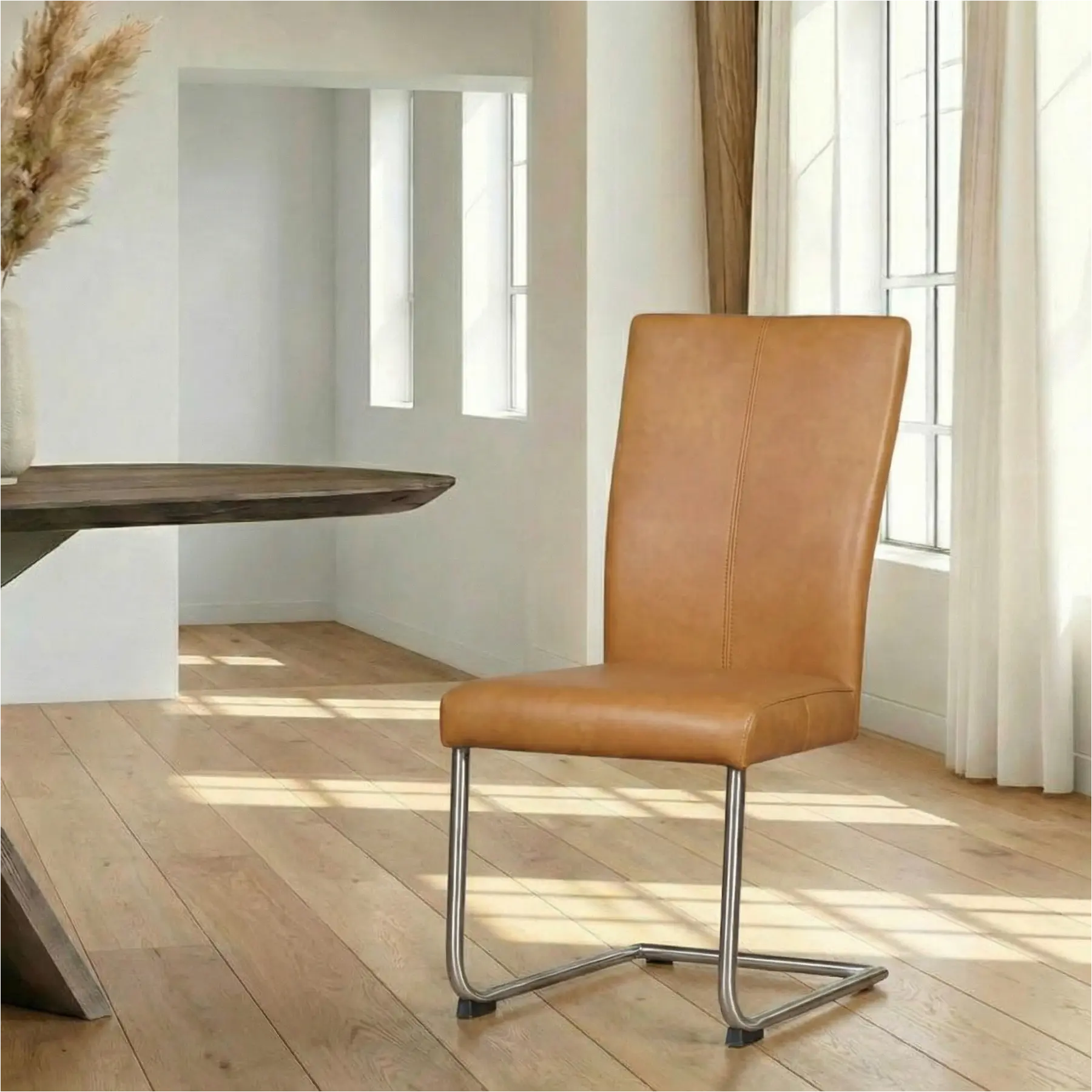 afbeelding van Leren eetkamerstoel Dry - Granada Sahara (cognac) - Sledepoot staal rond RVS