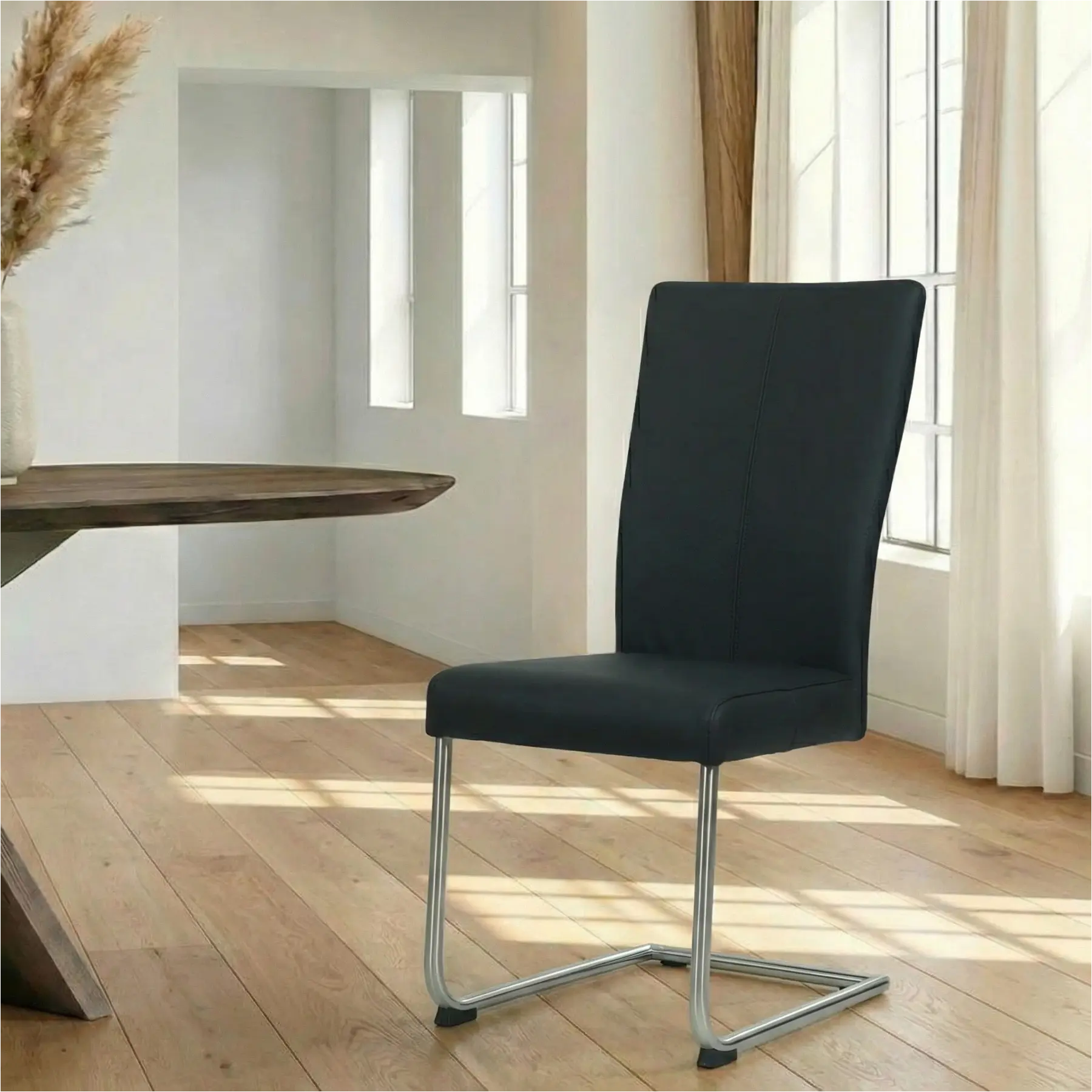 afbeelding van Leren eetkamerstoel Dry - Hermes Nero (zwart) - Sledepoot staal rond RVS