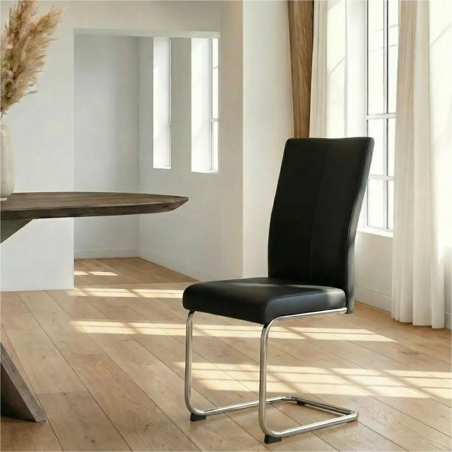 afbeelding van Leren eetkamerstoel Dry - Toledo Nero (zwart) - Sledepoot staal rond RVS