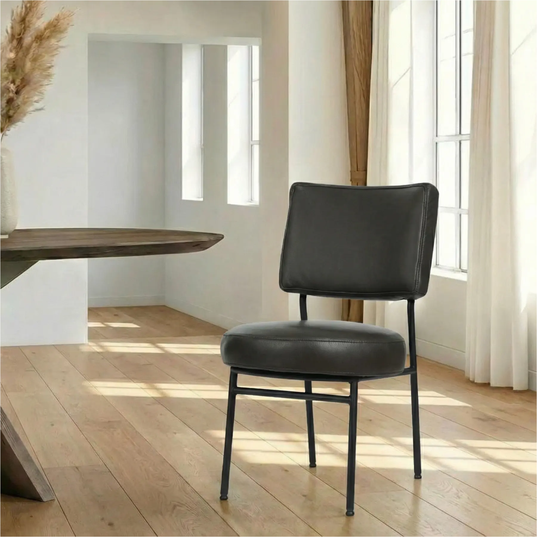 afbeelding van Leren eetkamerstoel Rondo - Granada Graphite (donkergrijs) - Poten staal rond zwart