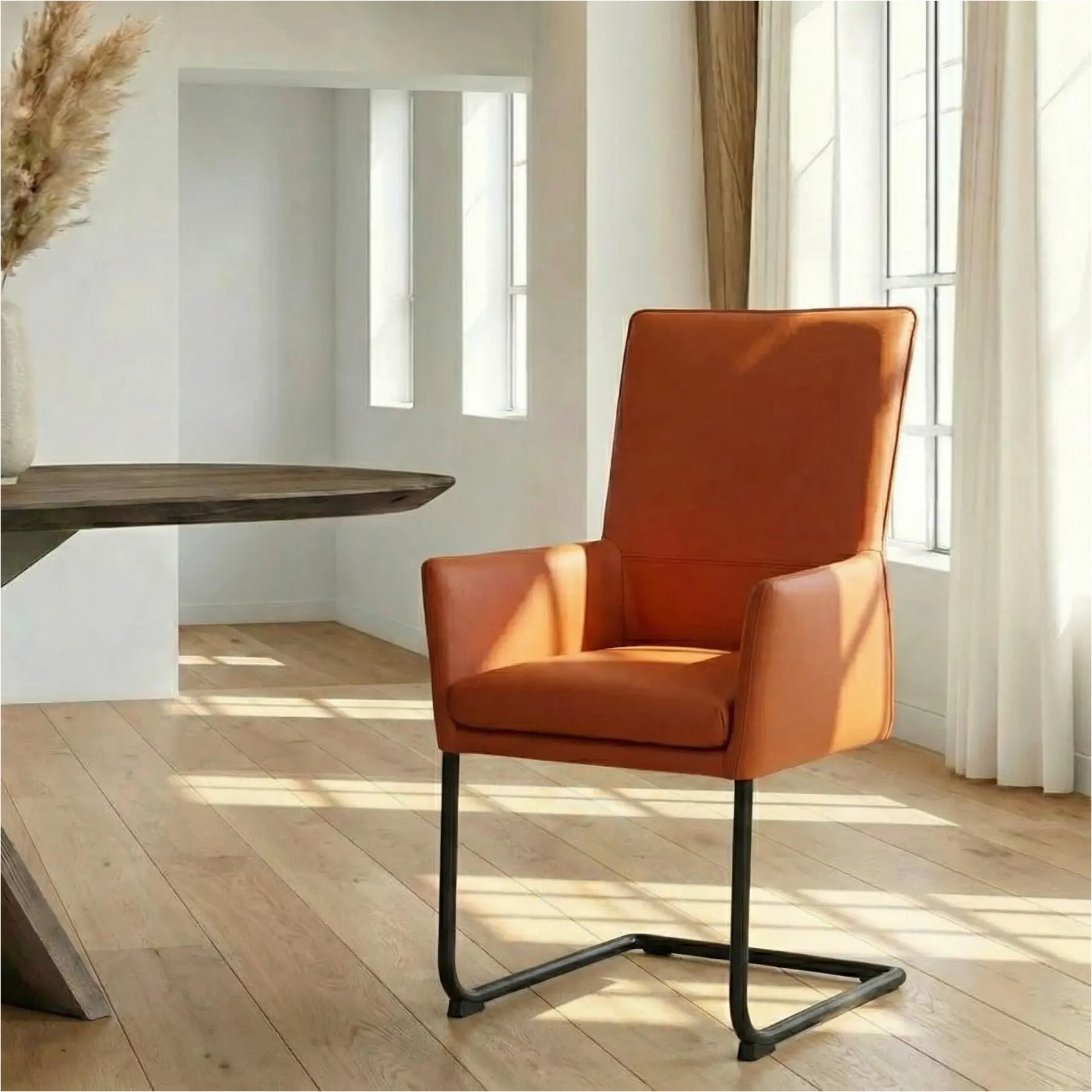 afbeelding van Leren eetkamerstoel Rumor - Toledo Cotto (cognac) - Sledepoot staal rond zwart