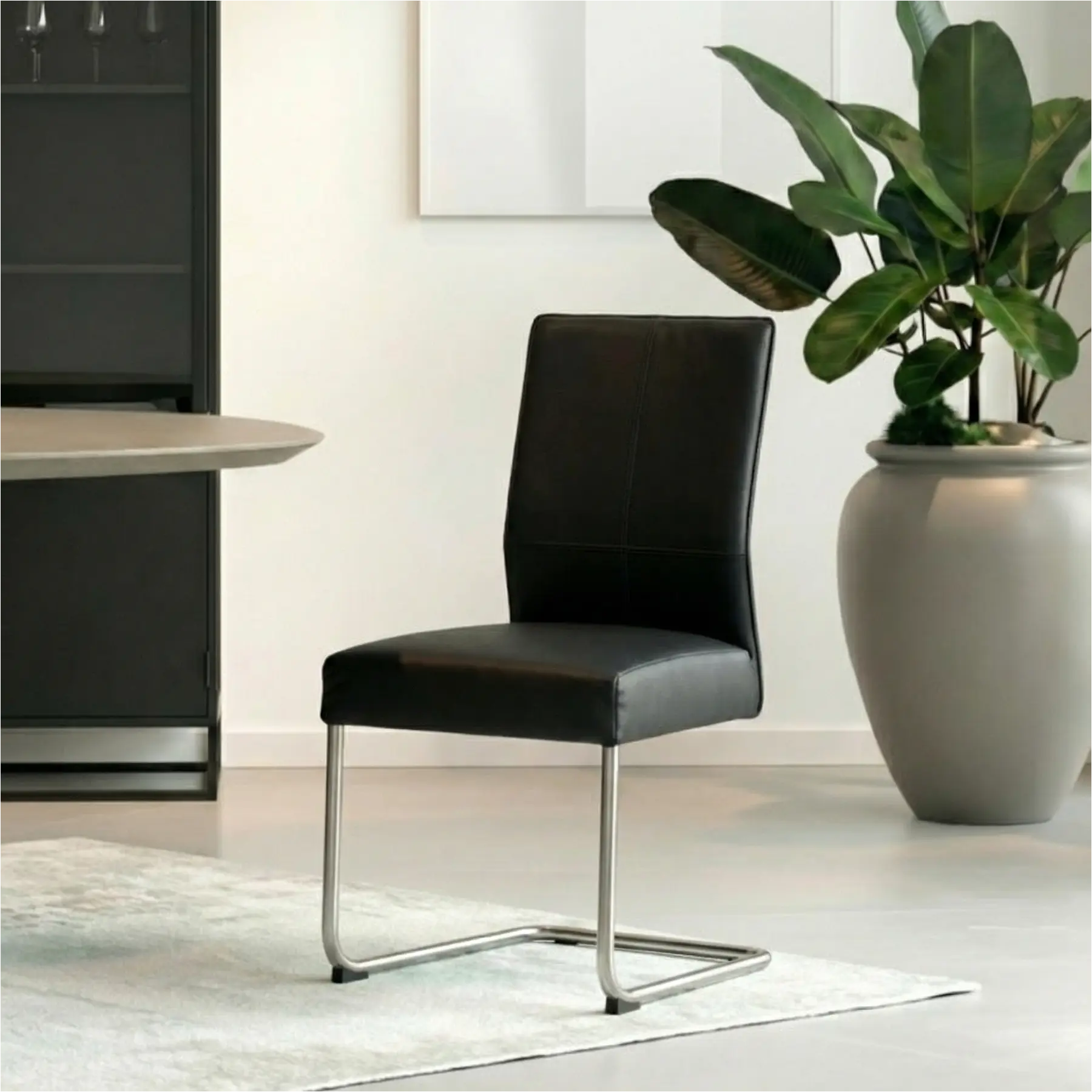 afbeelding van Set van 10 Leren eetkamerstoelen Piece - Hermes Nero (zwart) - Sledepoot staal rond RVS