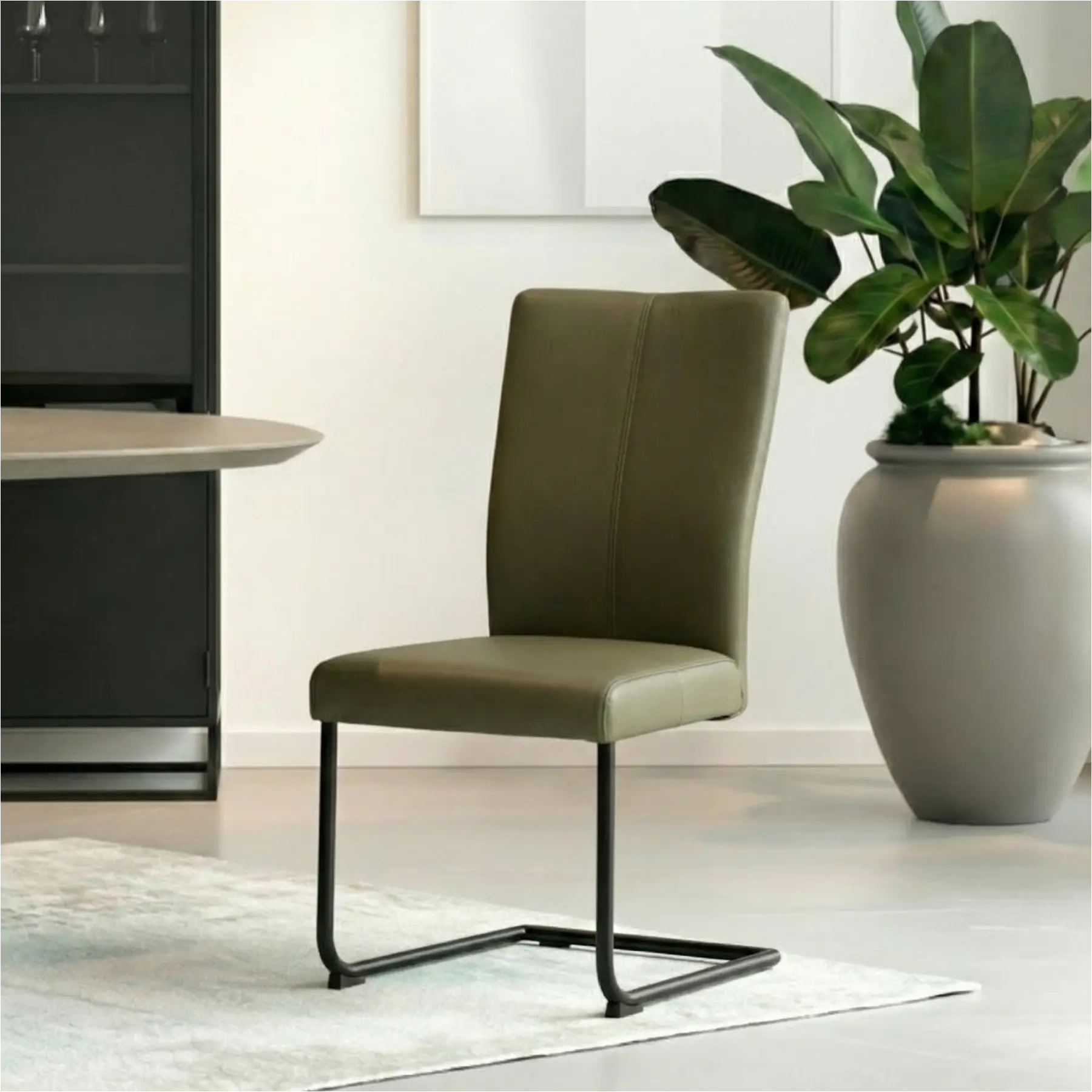 afbeelding van Set van 4 Leren eetkamerstoelen Dry - Toledo Olive (olijf/goen) - Sledepoot staal rond zwart