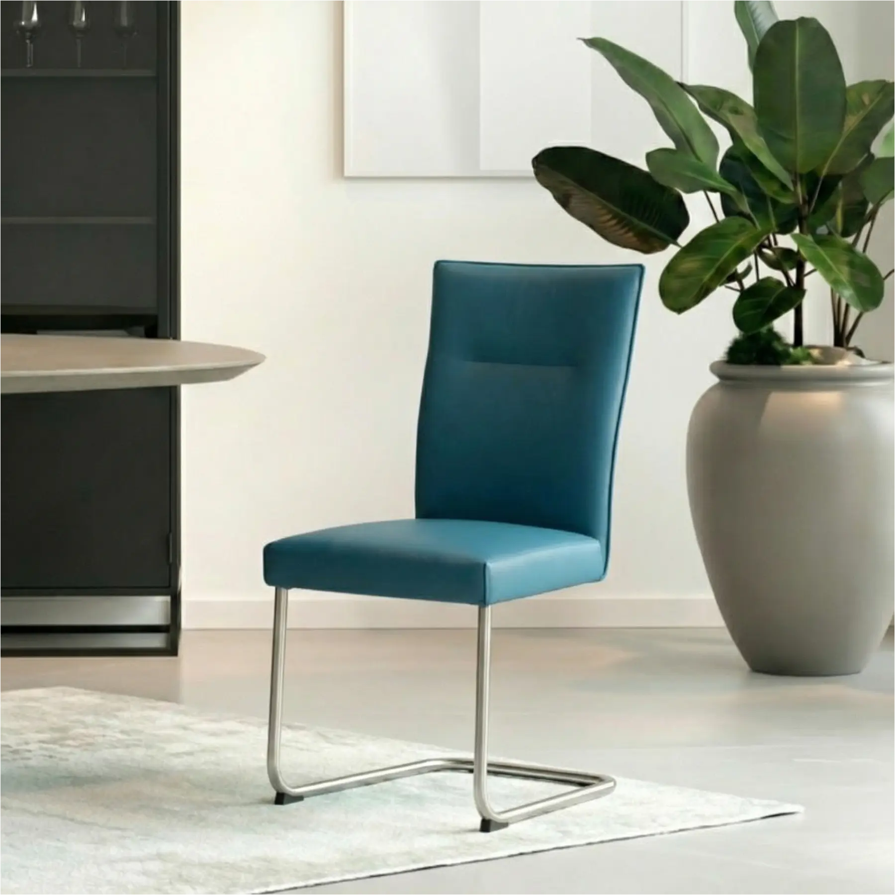 afbeelding van Set van 8 Leren eetkamerstoelen Retro - Toledo Turquoise (blauw) - Sledepoot staal rond RVS